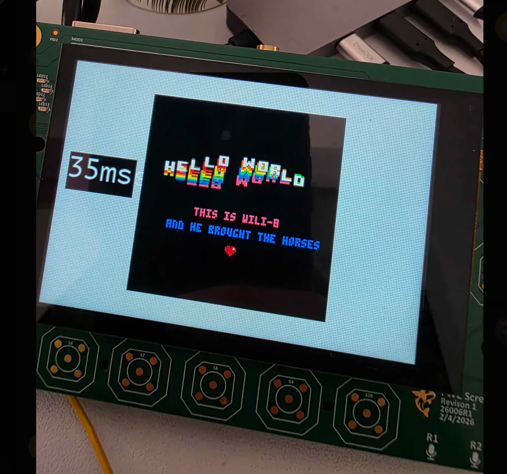 FreeWili2 board running a Hello World demo on its display